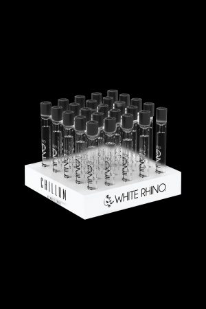 Display of “Chillum” and “White Rhino” branded cannabis oil cartridges on a white riser.