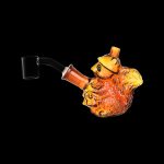 Orange glass bubbler shaped like a pufferfish with a black mouthpiece.
