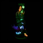 Glowing green glass bong with claw-like accents and “420” text, set against a black background.