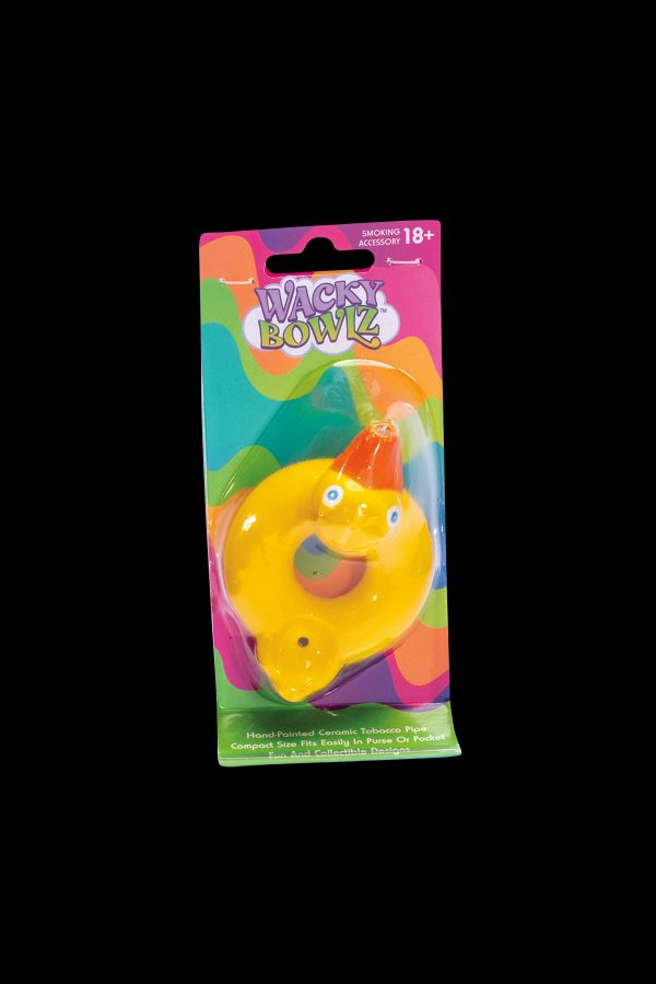 A colorful, ceramic pipe shaped like a duck, packaged on a card labeled "Wacky Bowlz" with an 18+ smoking accessory warning.