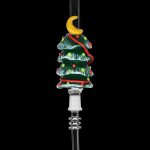 Glass cannabis pipe shaped like a decorated Christmas tree with a crescent moon topper.