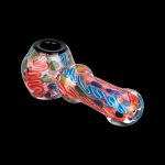 Hand-blown glass pipe with vibrant red, blue, and yellow swirls against a black background.
