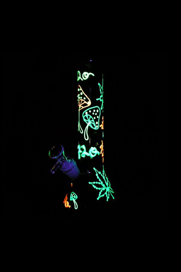 Neon cannabis and mushroom illustrations on a black glass smoking piece.
