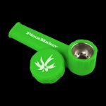 A close-up shot of the “PieceMaker Karma” silicone pipe, displaying its curved shape and dark color against a plain background.