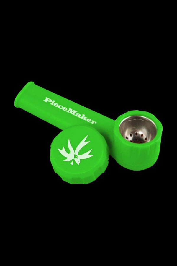 A close-up shot of the “PieceMaker Karma” silicone pipe, displaying its curved shape and dark color against a plain background.