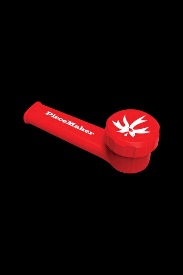 Close-up of the PieceMaker "Karma" Silicone Pipe, showcasing its rounded, red design against a stark black background.