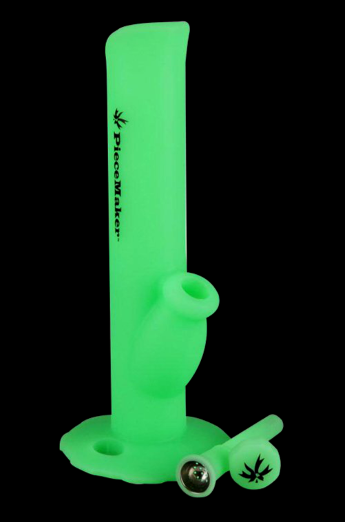 Neon green glass water pipe with cannabis leaf branding.