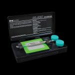 Overhead view of the Pro Scale Slick Concentrate Kit & Scale displayed open with various components and a quick start guide.