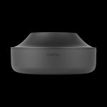 A studio shot of the Puffco Peak Pro Power Dock, showcasing its sleek, black, circular design from a slightly angled, top-down perspective.