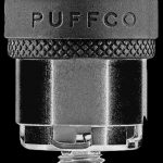 A close-up, angled view of the Puffco Peak Replacement Atomizer, showing its silver metallic finish and textured grip.