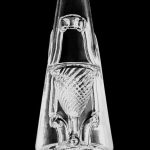 Front view of the Puffco x Ryan Fitt Recycler Glass for Peak & Peak Pro, a clear glass piece with intricate swirling patterns.