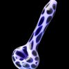 A three-quarter view of the Pulsar Animal Spots Spoon Pipe, featuring a spotted pattern on clear glass.