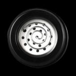 Close-up view of the Pulsar Barb Flower Replacement Coil, showcasing its circular, patterned design against a dark background.