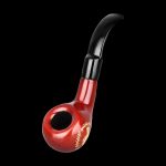 Red glass pipe with black accents against a black background.