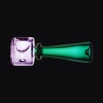 A side view of the Pulsar Stacked Geometric Hand Pipe, showing its stacked, geometric design in a vibrant, clear glass finish.