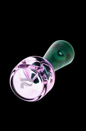 A close-up, angled view of the Pulsar Stacked Geometric Hand Pipe, showcasing its unique stacked design in clear glass.