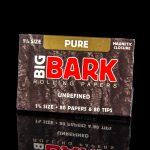 Pack of “Big Bark” rolling papers and tips against a dark background.