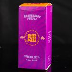 Purple box for a “Sherlock 4 in.” pipe with cannabis leaf graphics, reflected on a black surface.