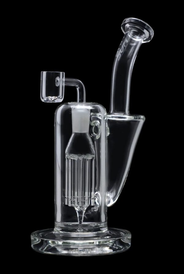 Clear glass dab rig with intricate percolator chamber, isolated on a black background.