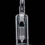 Clear glass dab rig with intricate percolator design, isolated on a black background.