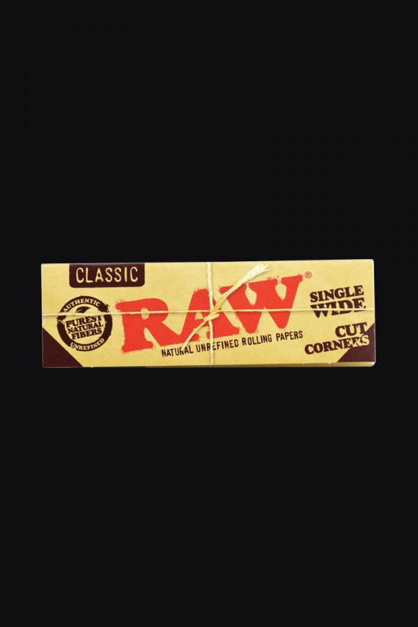 A close-up of the "RAW "Cut Corners" Single Wide Rolling Papers" package, showcasing the brand logo and text on its colorful surface.