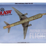 The RAW "Prepare for Flight" Rolling Tray displays a graphic of an airplane wing against a blue backdrop.