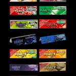 A grid of colorful, flavored rolling paper packs branded "JUICY JAYS," displaying flavors like marshmallow, candy cane, blueberry, banana, and watermelon, with legal disclaimers visible on each pack.