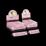 Stacked packs of pink “Blazy Susan” rolling papers with a checkerboard pattern, displayed on a black background.