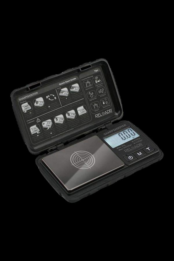 Digital scale with open case displaying quick start guide, likely for measuring cannabis.
