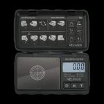 Digital scale displaying “0.000” with a black and grey design, open on a dark surface.