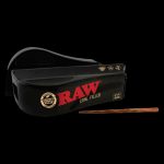 A close-up, angled view of the RAW 1 ¼” Pre-rolled Cone Filler Machine, showing its black plastic construction and simple design.