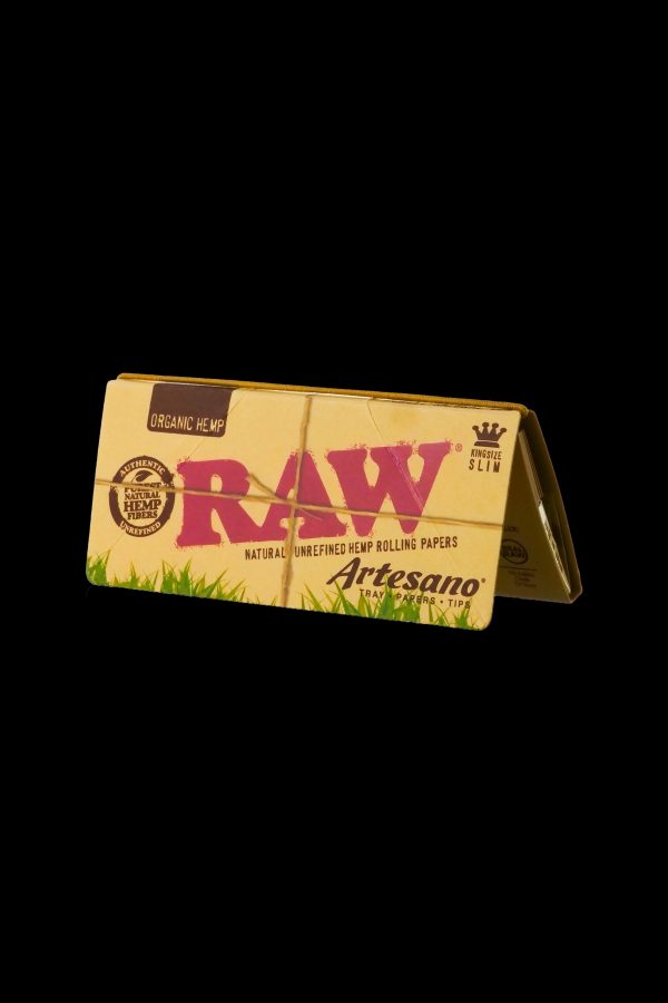 Pack of RAW Organic Hemp rolling papers and Artesano tips against a black background.