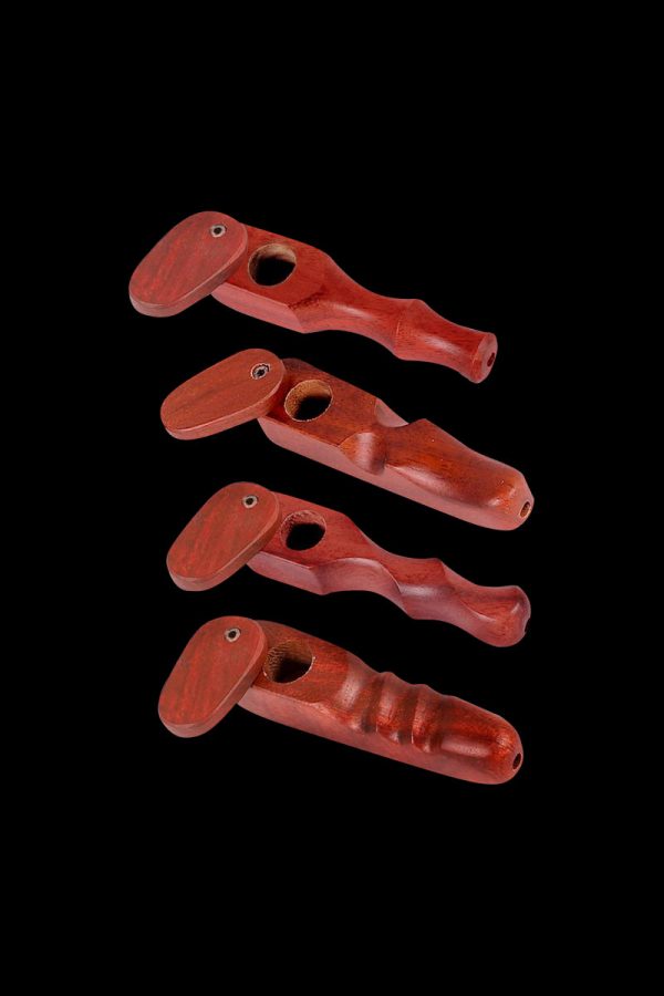 A side view of the Rosewood Spoon Pipe with Swivel Lid, showcasing its dark wood grain and curved design against a black background.