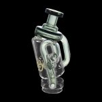 Green glass water pipe with intricate bubble design and yellow accents, isolated on a black background.