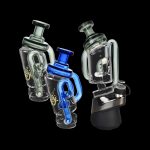 Two glass cannabis rigs with intricate designs, one featuring blue accents, against a black background.