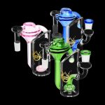 Colorful glass water pipes (bongs) with intricate designs on a black background.