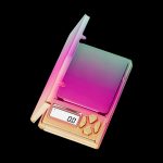 Iridescent digital scale with a display reading 0.07, likely used for measuring cannabis.