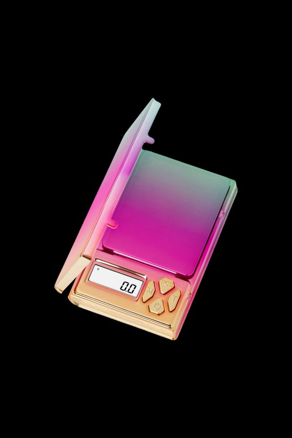 Iridescent digital scale with a display reading 0.07, likely used for measuring cannabis.