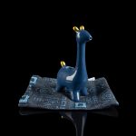 Blue giraffe-shaped water pipe resting on a patterned cloth with a reflective surface.