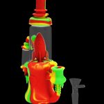 Red and green silicone water pipe with a rocket ship design, and a glass downstem beside it.