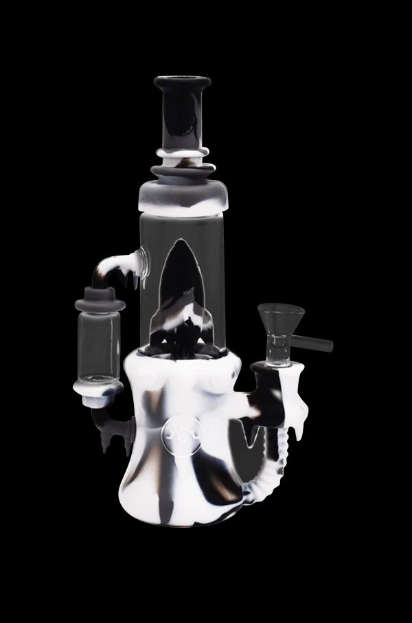 Black and white glass water pipe (rig) with intricate dripping design.
