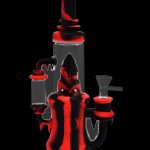 Red and clear glass water pipe (bong) isolated on a black background.