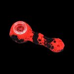 Red and black silicone smoking pipe on a black background.