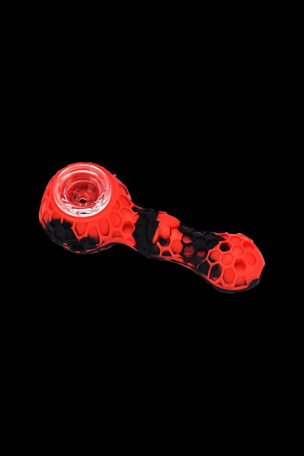 Red and black silicone smoking pipe on a black background.