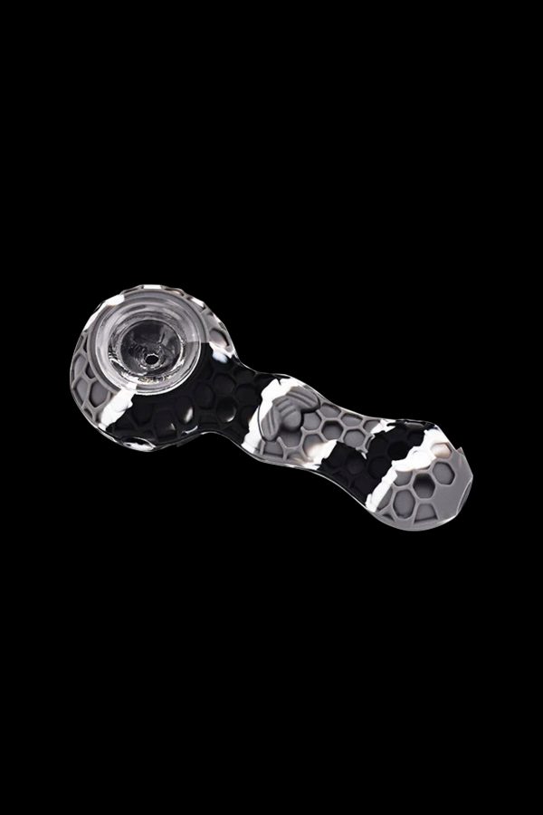 Black and white silicone cannabis pipe with skull pattern.