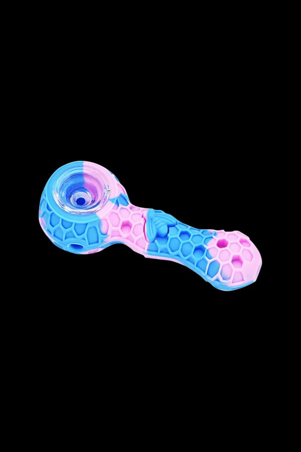 Pink and blue glass smoking pipe with textured grip.