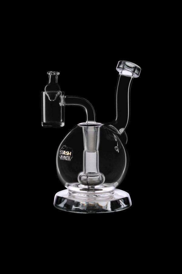 Clear glass dab rig with a bubbler and quartz nail, isolated on a black background.