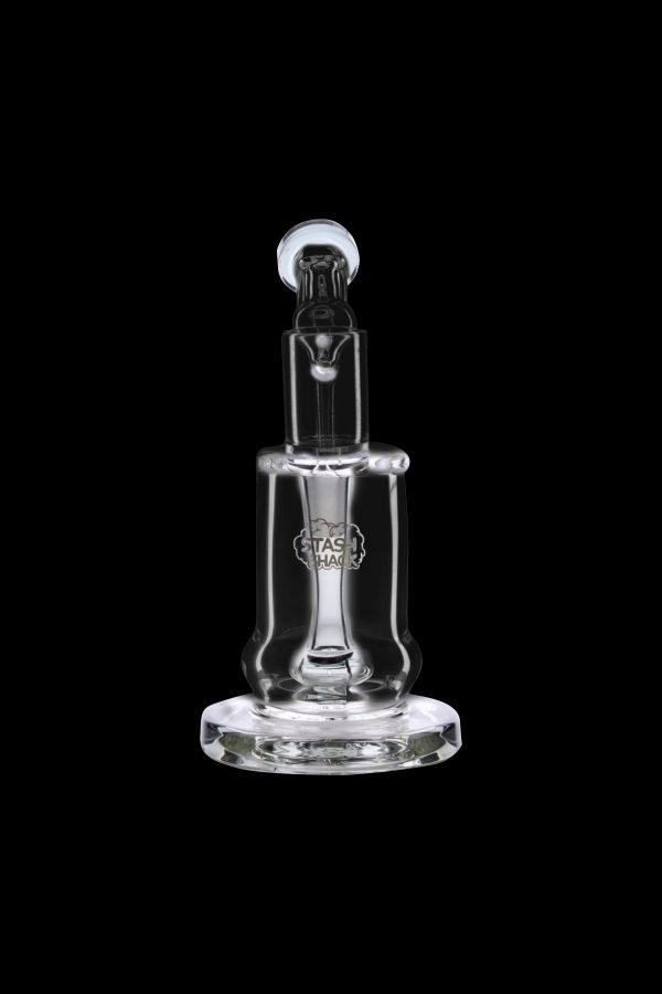 Clear glass dab rig with etched logo, isolated on black.