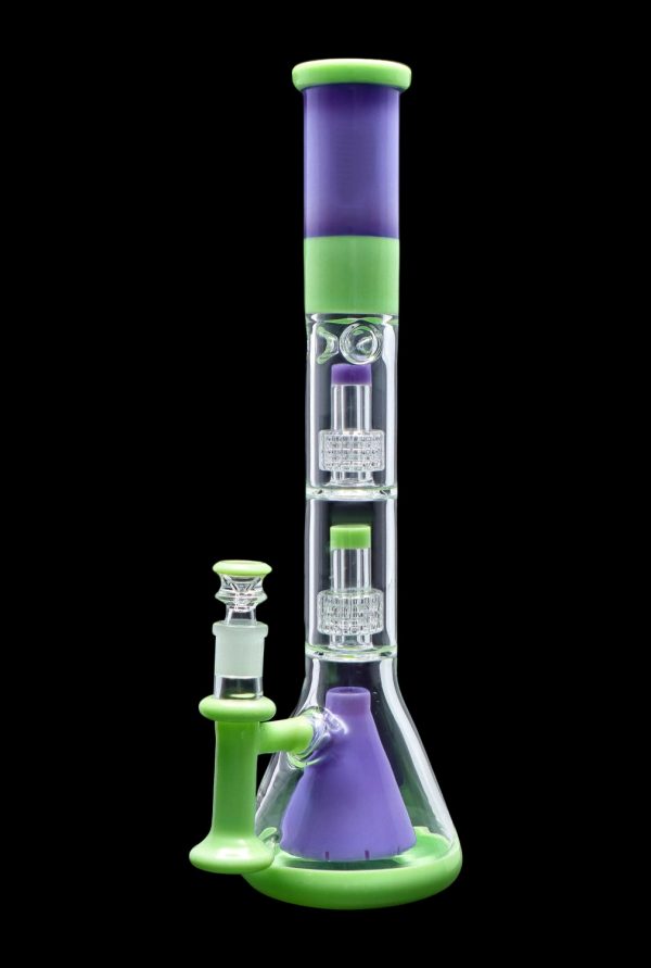A vibrant green and purple glass bong with intricate percolators.