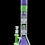 A vibrant green and purple glass bong with multiple filtration chambers and a separate glass bowl.